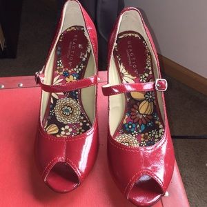 Red patent peep toe wedge heel.